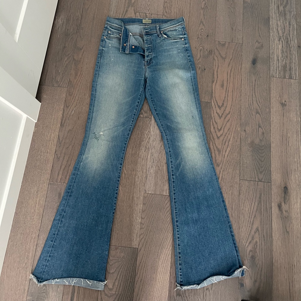 Mother button fly flares with raw hem